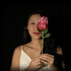 Girl with flower, adding a pop of colour to the photograph